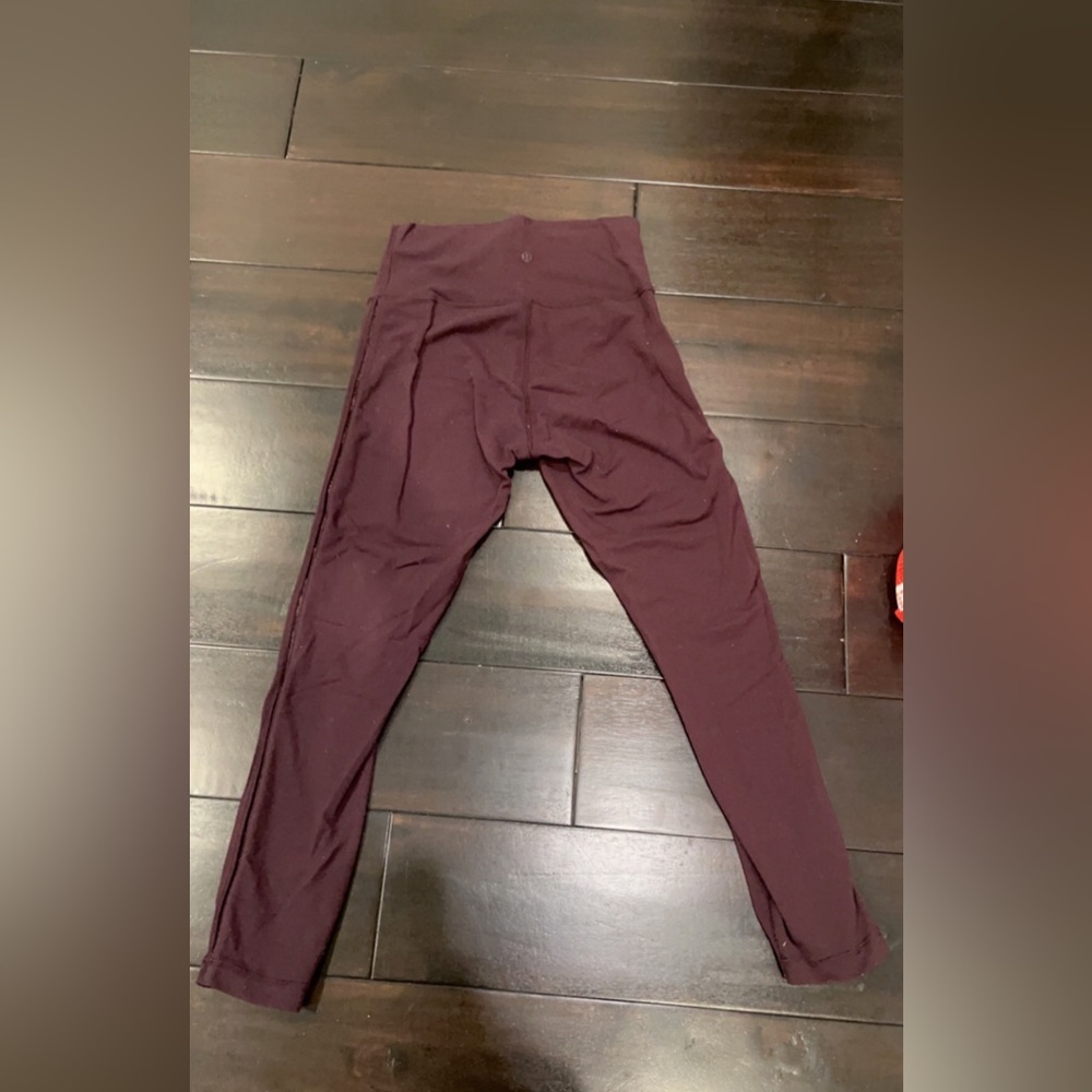 Lululemon cropped leggings with mesh side in plum color